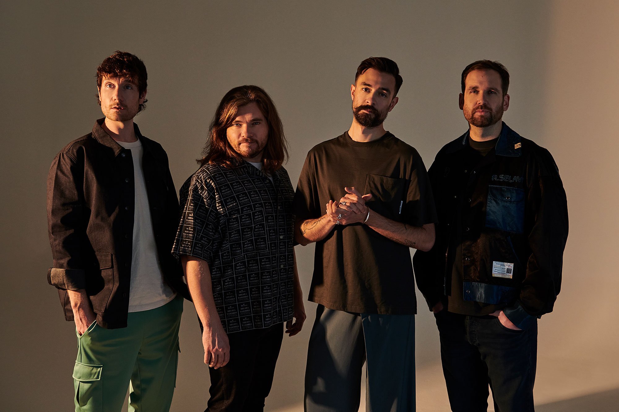 Bastille have dug out their best business attire for their new 'Shut Off The Lights video