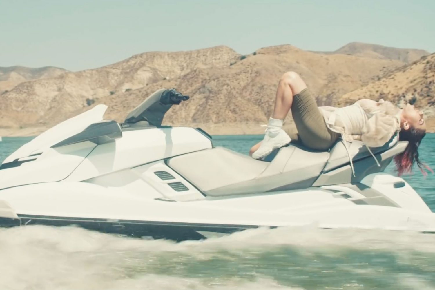 Charli XCX and Troye Sivan fanny about on jet skis for their new '2099' video