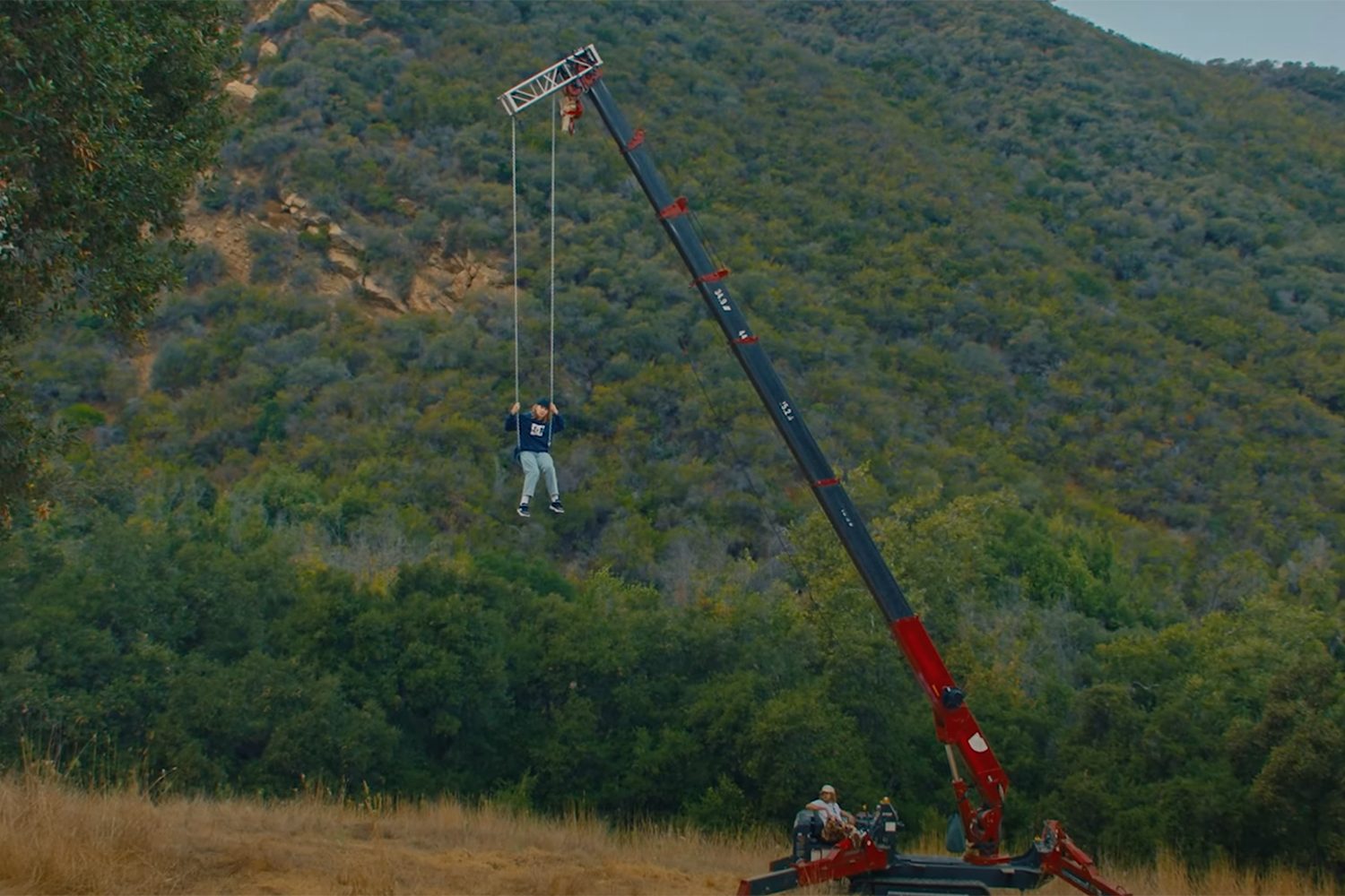 JAWNY dangles from a crane for his new 'Super Bad Mantra (ft Christian Blue)' video