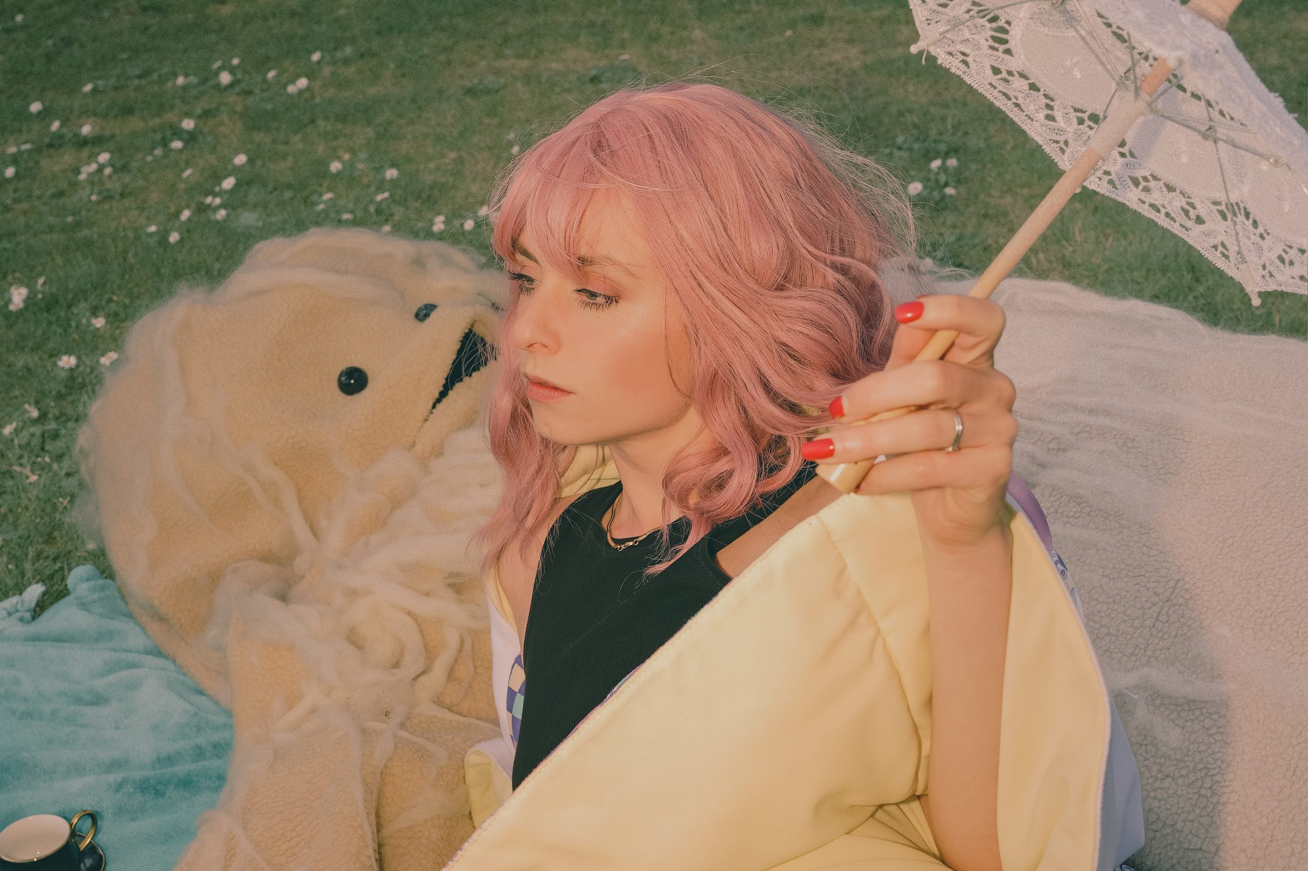 niina teams up with "harrowing yet curious monster" Patrick for her new video for 'girls just wanna have fun'