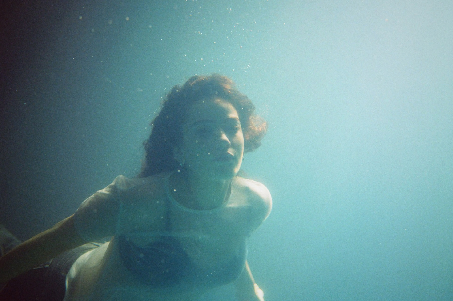 Talia Rae immerses herself in a surreal underwater world with her new 'Rocket Woman' video