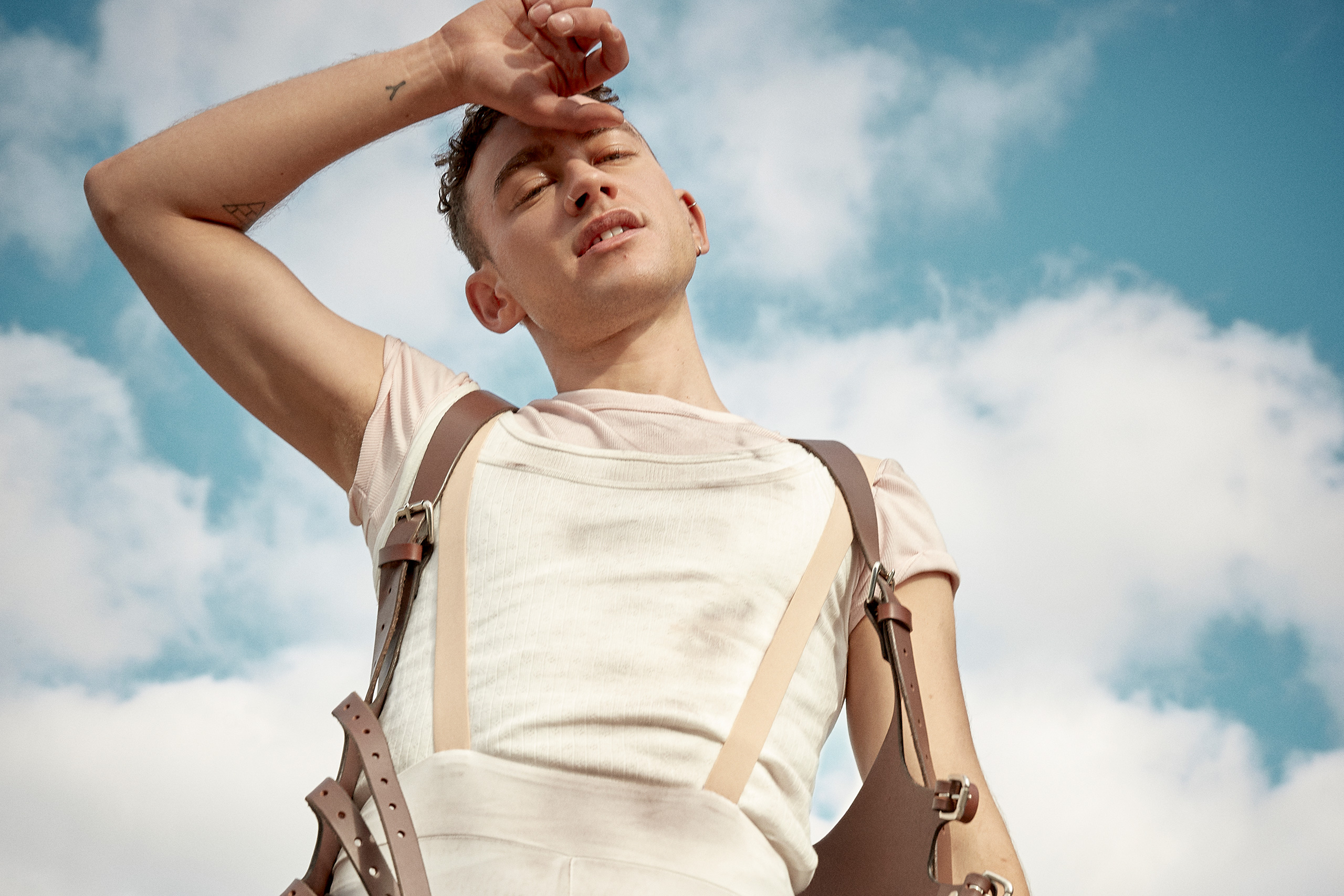 Olly Alexander is celebrating the release of his debut solo album 'Polari' with a new video for 'Whisper In The Waves'